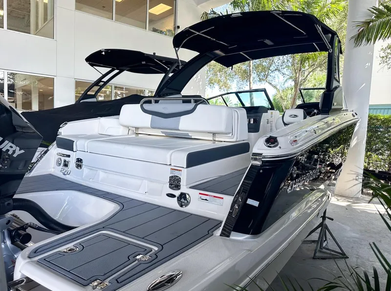 Slide: The Image of 2025 Chaparral 270 OSX OB boat with sleek design and modern features. - 34