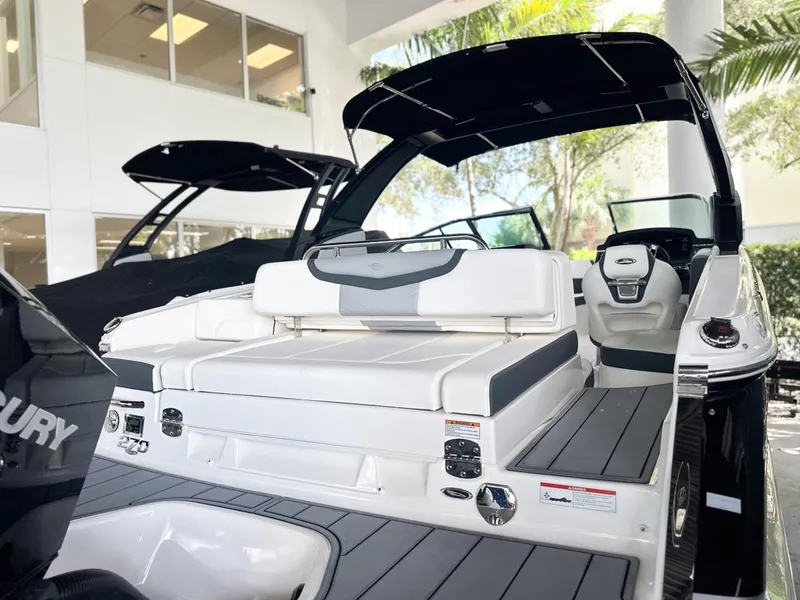Slide: The Image of 2025 Chaparral 270 OSX OB boat interior with sleek seating and modern design. - 9