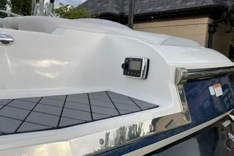 Slide: The Image of 2015 MasterCraft X-55 boat deck with control panel and sleek design. - 5