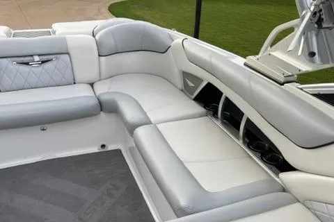 Slide: The Image of 2015 MasterCraft X-55 boat interior with white and gray seating. - 6
