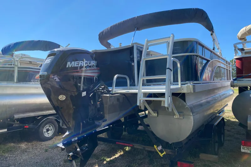 Slide: The Image of 2018 Bennington 22 SFX pontoon boat with Mercury outboard motor. - 4