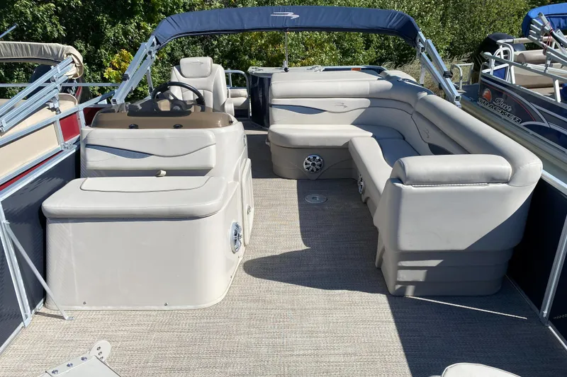 Slide: The Image of 2018 Bennington 22 SFX pontoon boat interior with spacious seating and helm. - 6