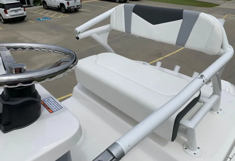 Slide: The Image of 2026 Robalo 246 Cayman Sky Deck helm with steering wheel and seating. - 5