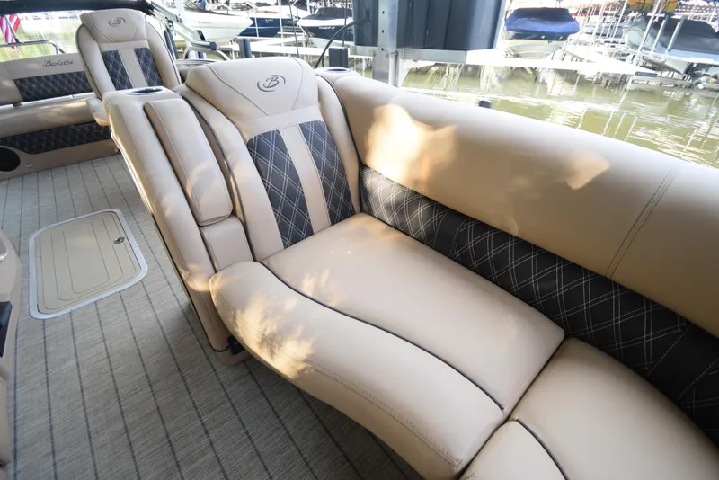 Slide: The Image of Luxurious seating on 2022 Barletta Lusso 23UC pontoon boat, docked by the water. - 39