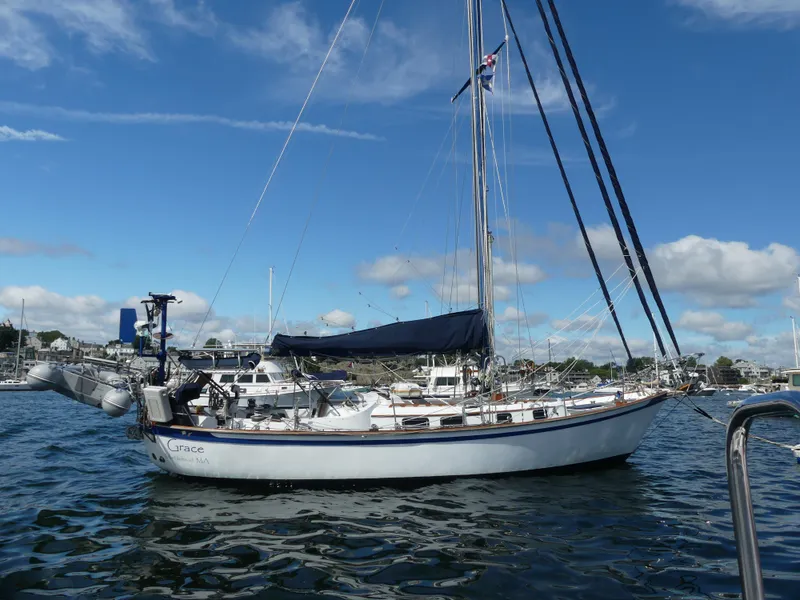 The Image of 1981 Southern Cross 39' sailboat docked in a marina under a clear blue sky. - 0