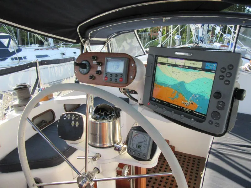 Slide: The Image of Cockpit of 1981 Southern Cross 39' sailboat with navigation equipment and steering wheel. - 11