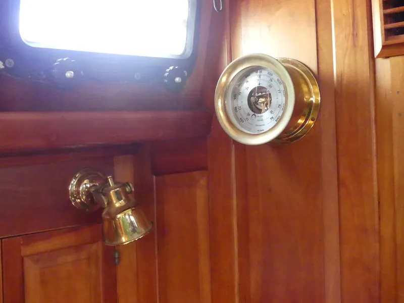 Slide: The Image of Wooden interior of 1981 Southern Cross 39' yacht with brass barometer and light fixture. - 21