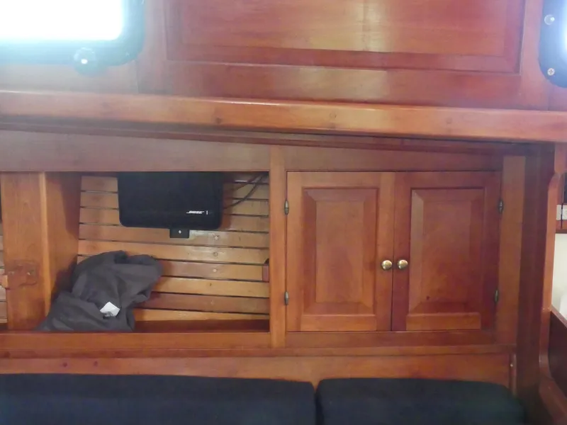 Slide: The Image of Wooden interior of 1981 Southern Cross 39' yacht with cabinets and seating. - 24