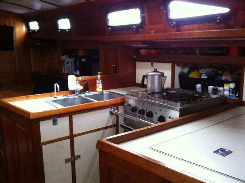 Slide: The Image of Interior of 1981 Southern Cross 39' yacht with kitchen and wooden cabinetry. - 30