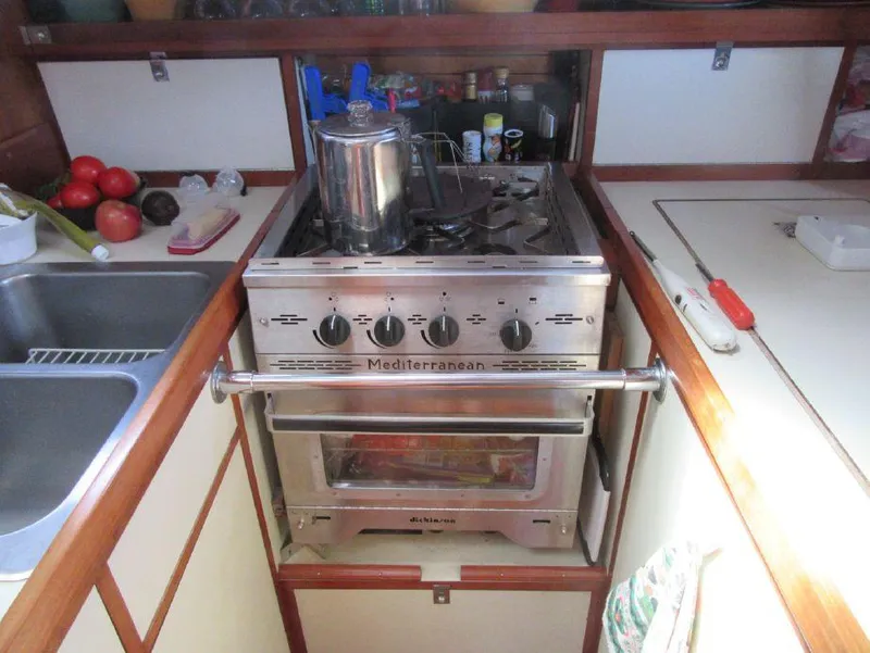 Slide: The Image of Galley kitchen in 1981 Southern Cross 39' yacht with stove and fresh produce. - 31