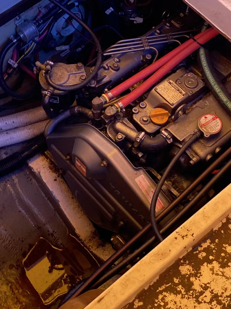 Slide: The Image of Engine compartment of a 1981 Southern Cross 39' boat, showing mechanical components and wiring. - 41