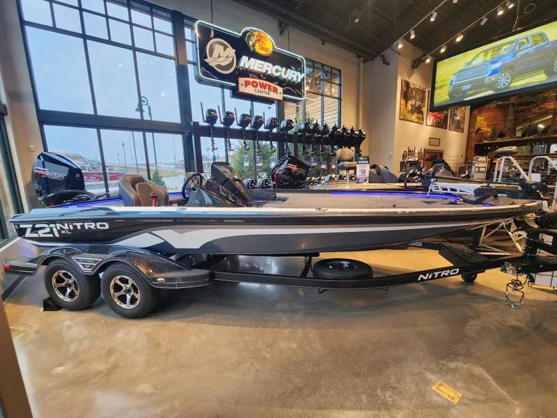 Slide: The Image of 2023 Nitro Z21 XL boat displayed in showroom with Mercury signage. - 3