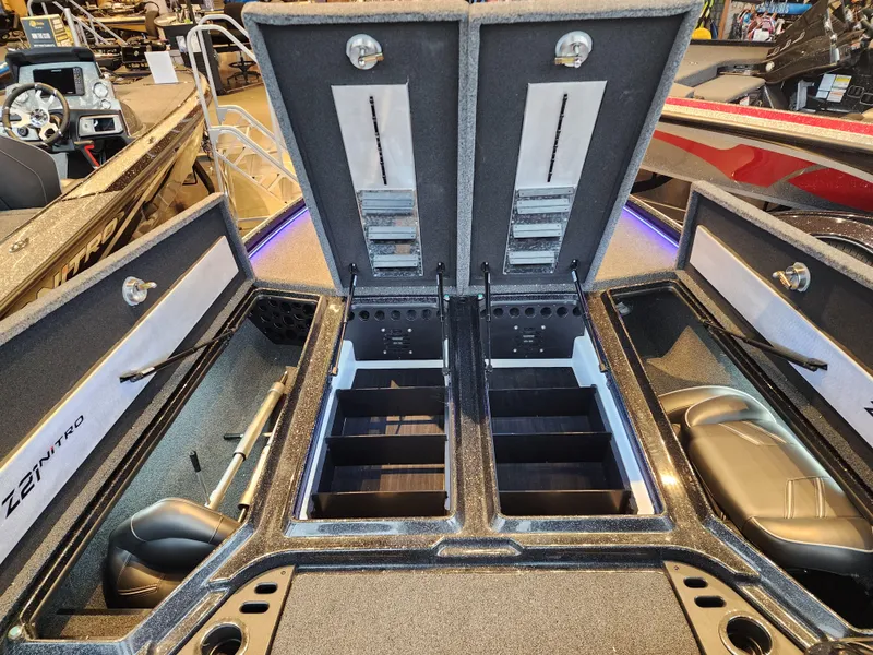 Slide: The Image of 2023 Nitro Z21 XL boat interior with open storage compartments and seating. - 5