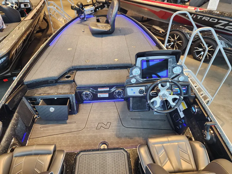 Slide: The Image of 2023 Nitro Z21 XL boat interior with modern dashboard and seating. - 6