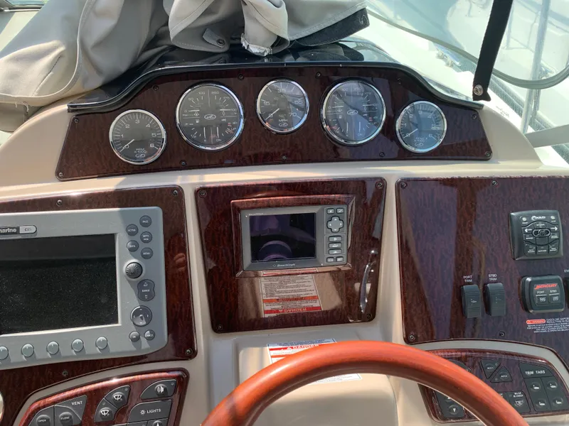 Slide: The Image of Dashboard of 2008 Sea Ray 330 Sundancer with gauges and navigation controls. - 10