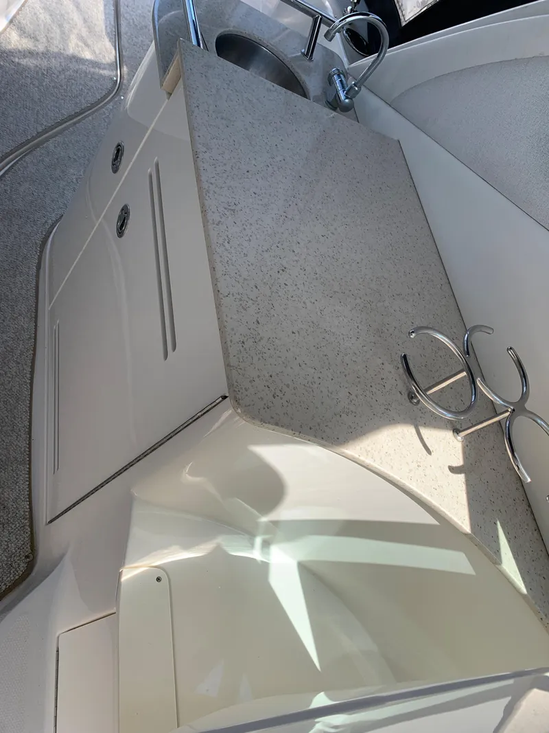 Slide: The Image of 2008 Sea Ray 330 Sundancer boat interior with countertop and sink. - 13