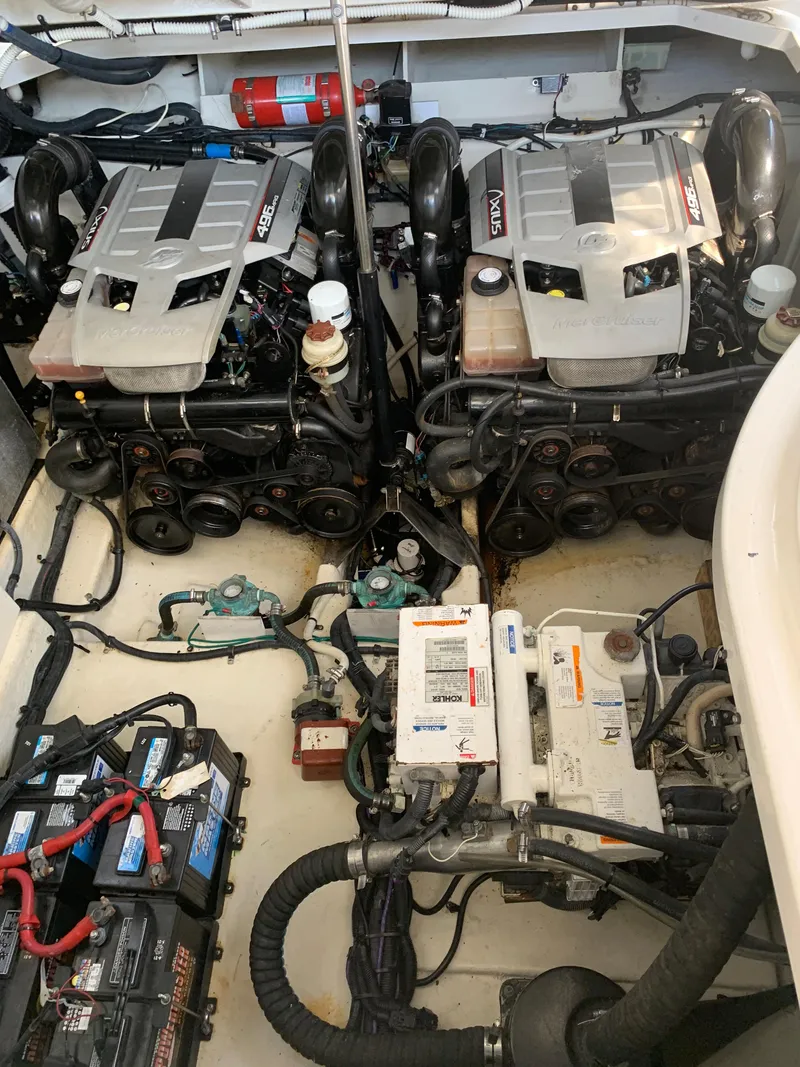 Slide: The Image of Engine room of 2008 Sea Ray 330 Sundancer with dual engines and equipment. - 14