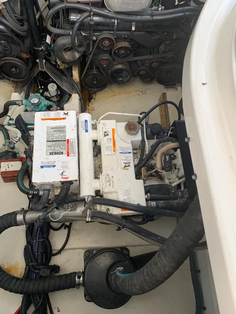 Slide: The Image of Engine compartment of 2008 Sea Ray 330 Sundancer boat, showing mechanical components. - 15