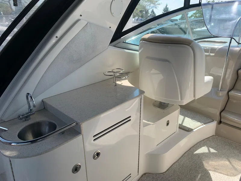 Slide: The Image of 2008 Sea Ray 330 Sundancer interior with sink and seating area. - 3