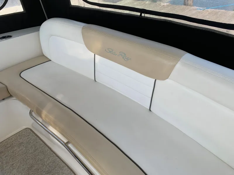 Slide: The Image of 2008 Sea Ray 330 Sundancer interior seating with beige and white upholstery. - 4