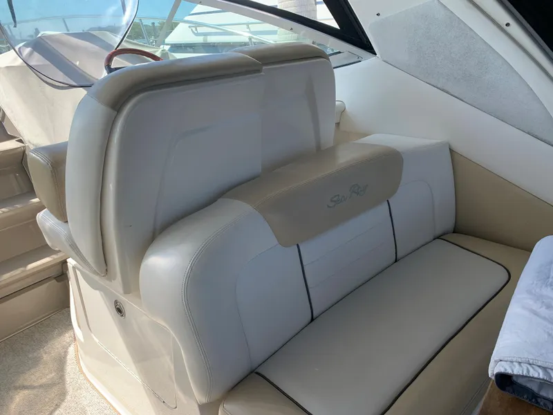 Slide: The Image of 2008 Sea Ray 330 Sundancer interior seating with beige upholstery. - 5