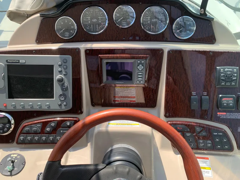Slide: The Image of Dashboard of 2008 Sea Ray 330 Sundancer with navigation and control instruments. - 6