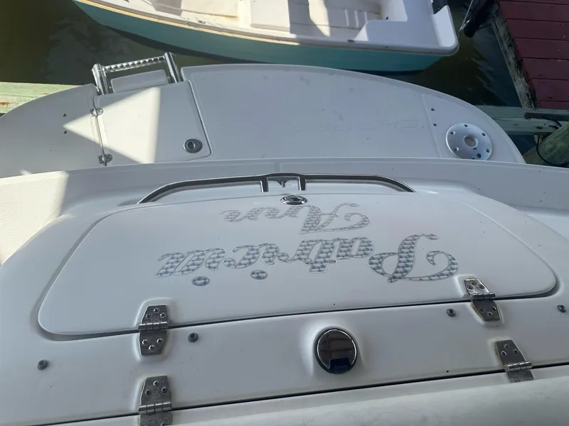 Slide: The Image of 2003 Chaparral 215 SS Cuddy boat stern view at dock. - 10