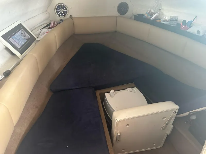 Slide: The Image of Interior of 2003 Chaparral 215 SS Cuddy cabin with seating and portable toilet. - 7