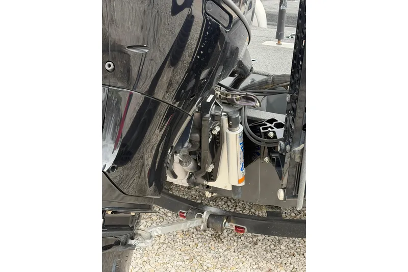 Slide: The Image of 2022 SeaArk Stealth 210 boat motor and hydraulic system close-up. - 6