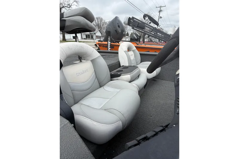 Slide: The Image of 2022 SeaArk Stealth 210 boat interior with gray seating and steering wheel. - 7