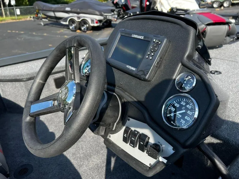 Slide: The Image of Dashboard of a 2023 Ranger RT178 boat with steering wheel and gauges. - 5