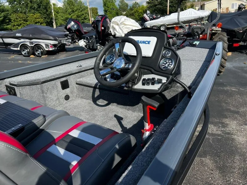 Slide: The Image of 2023 Ranger RT178 boat interior with steering wheel and dashboard controls. - 6
