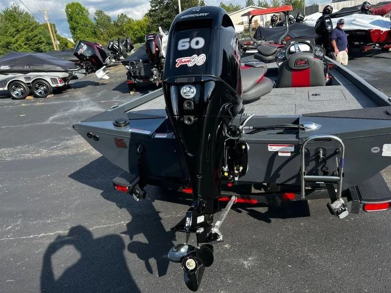 Slide: The Image of 2023 Ranger RT178 boat with Mercury 60 engine, parked outdoors. - 9