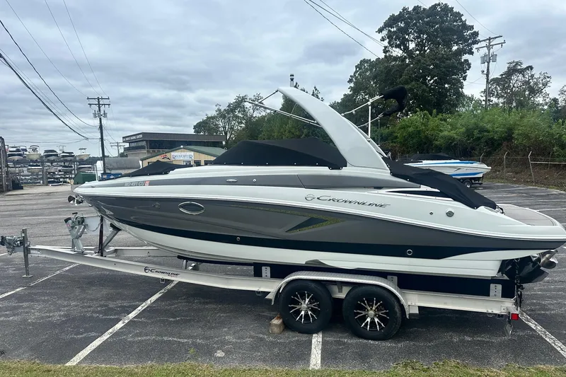 Slide: The Image of 2023 Crownline 270 SS boat on trailer in parking lot. - 1