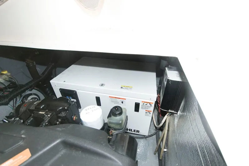 Slide: The Image of Engine compartment of 2002 Rinker 342 Fiesta Vee with Kohler generator. - 17