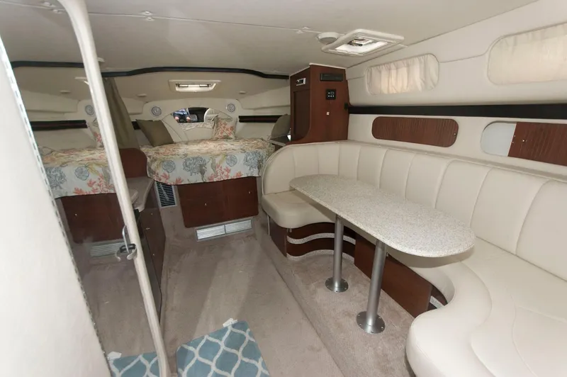 Slide: The Image of Interior of 2002 Rinker 342 Fiesta Vee yacht with seating and sleeping area. - 9