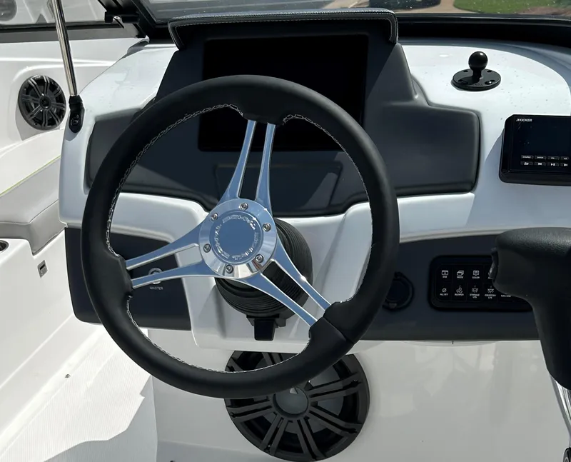Slide: The Image of Steering wheel and dashboard of 2023 Tahoe 210 Si boat. - 3