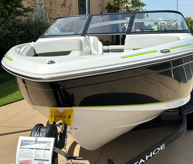 Slide: The Image of 2023 Tahoe 210 Si boat on display outdoors. - 7
