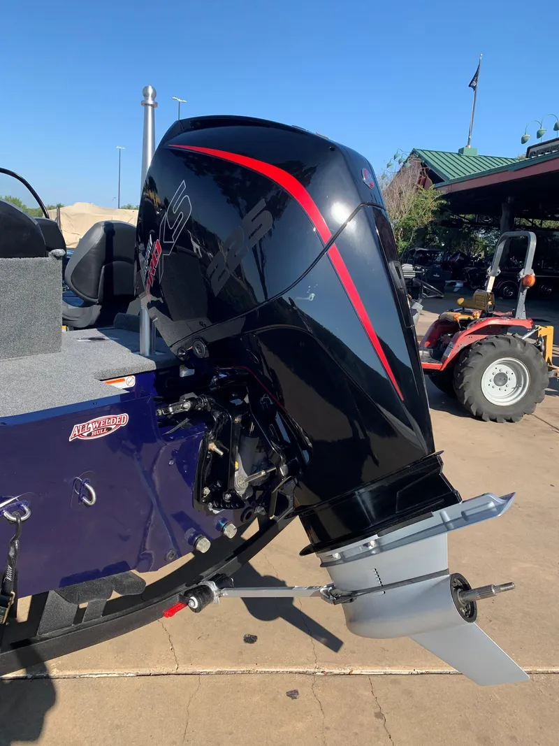 Slide: The Image of 2023 Tracker Targa V-19 WT boat interior with steering wheel and seating. - 3