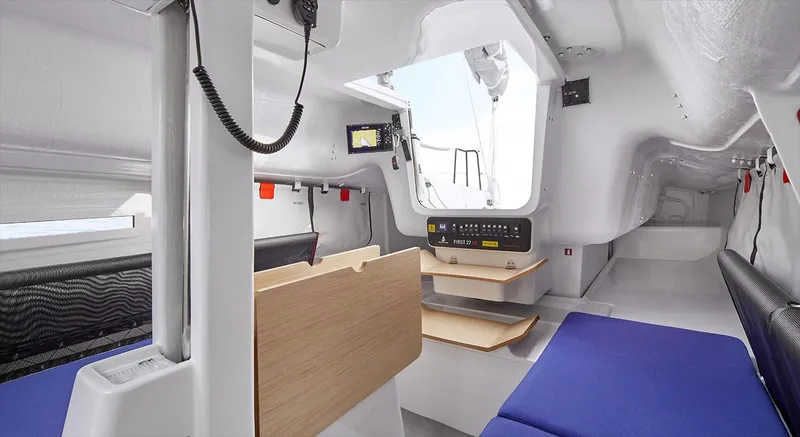 Slide: The Image of Interior of 2024 Beneteau First 27 sailboat, featuring modern design and compact layout. - 3