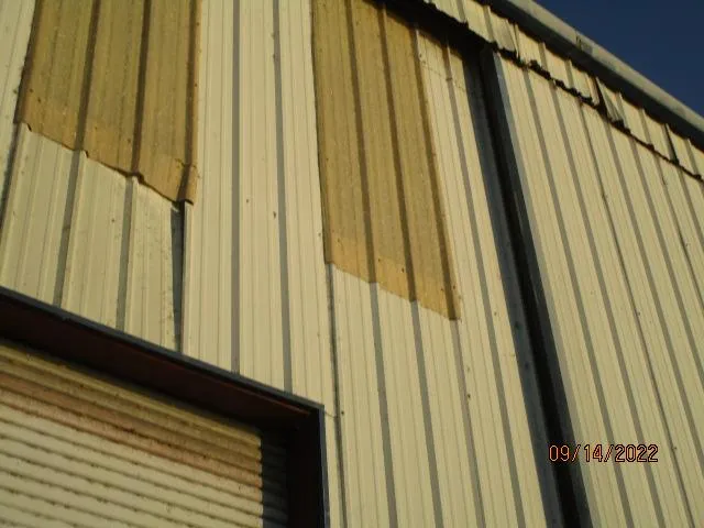 Slide: The Image of Exterior of a metal building with corrugated panels, dated September 14, 2022. - 10