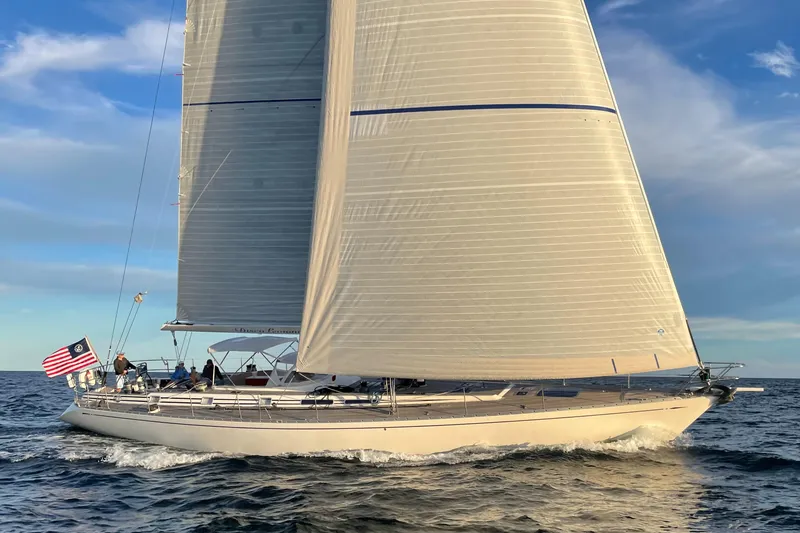 Slide: The Image of Nautor Swan 68 sailboat, 1992 model, sailing on open water with full sails. - 0