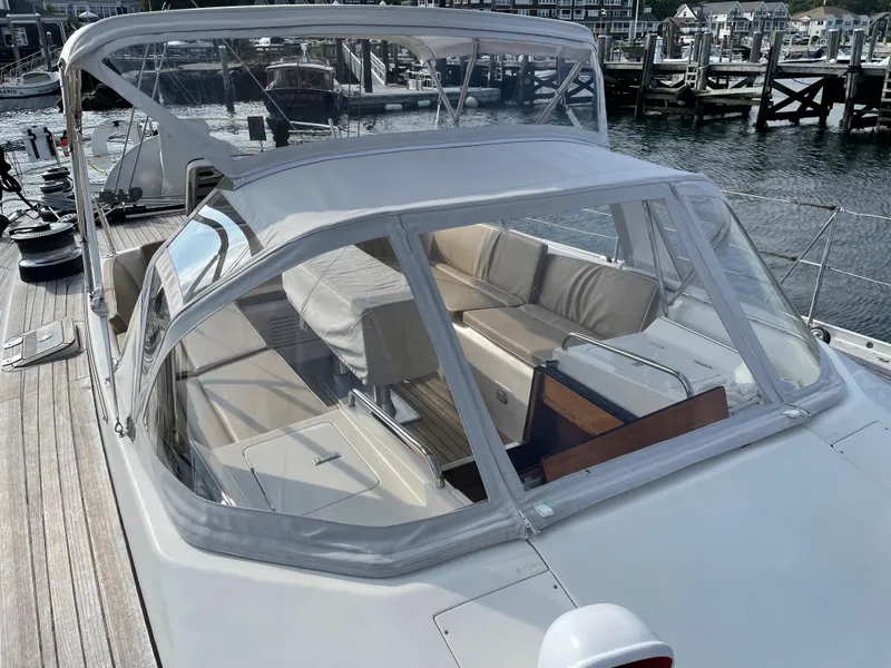 Slide: The Image of Nautor Swan 68 yacht cockpit with clear canopy, docked at marina, 1992 model. - 10
