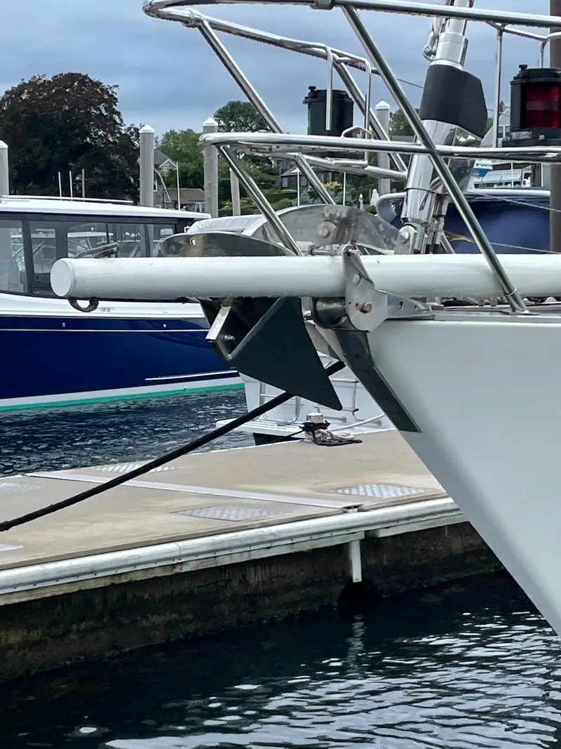 Slide: The Image of Bow of a 1992 Nautor Swan 68 yacht docked at a marina. - 13