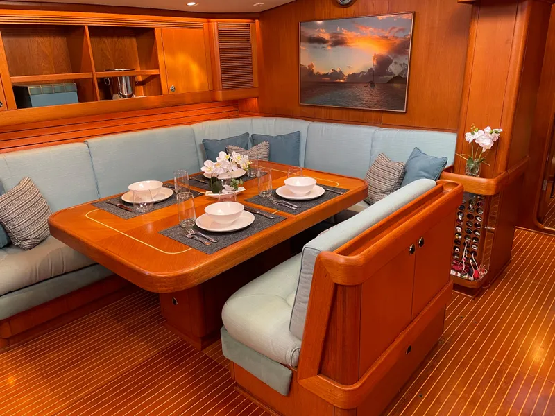 Slide: The Image of Luxurious dining area on a 1992 Nautor Swan 68 yacht with elegant wood finish. - 15