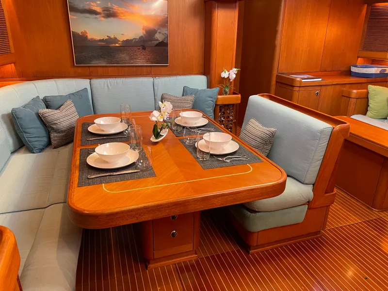 Slide: The Image of Luxurious dining area in a 1992 Nautor Swan 68 yacht with elegant table setting. - 16