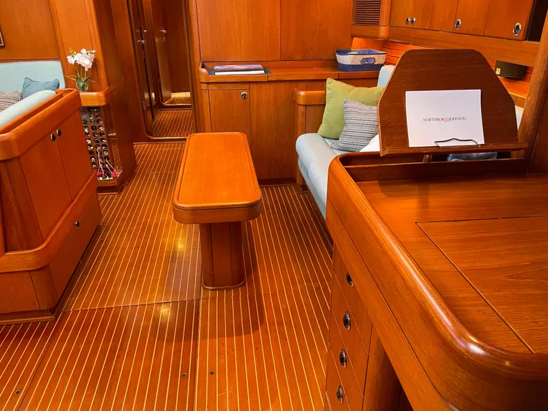 Slide: The Image of Interior of 1992 Nautor Swan 68 yacht with wooden furnishings and cozy seating. - 19