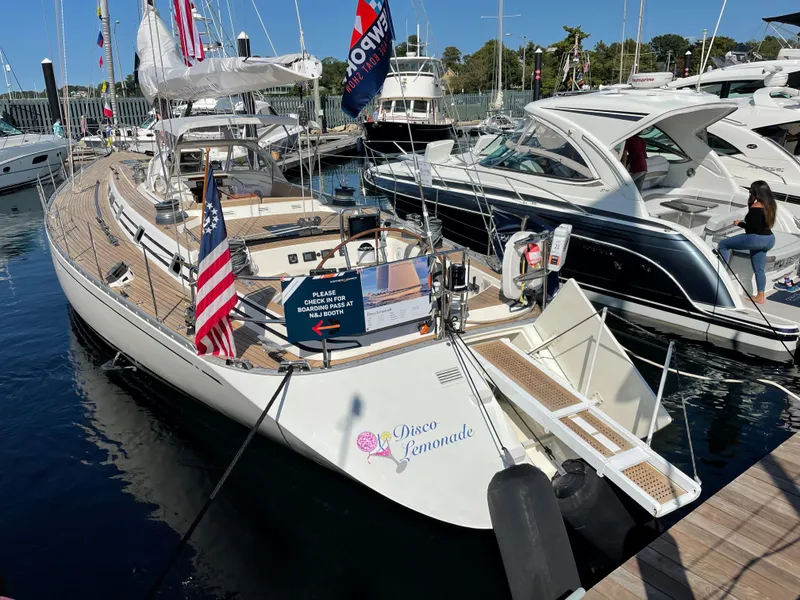 Slide: The Image of Nautor Swan 68 yacht, 1992 model, docked at marina with Disco Lemonade name. - 3
