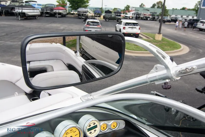 Slide: The Image of 2005 MasterCraft X45 boat interior with rearview mirror and dashboard gauges. - 34