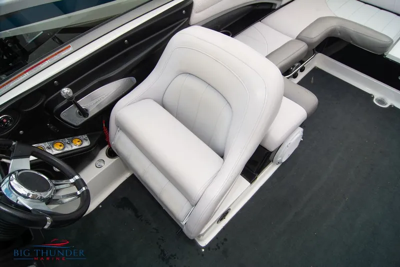 Slide: The Image of 2005 MasterCraft X45 boat interior with white captain's chair and steering wheel. - 37